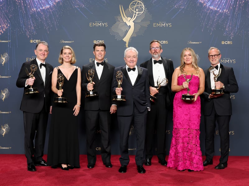 Javier Winnik, Caroline Maroney, Colin Jost, Lorne Michaels, Erik Kenward, Erin Doyle, and Tom Broecker, winners of Outstanding Variety Special for "SNL50: The Anniversary Special," pose in the press room during the 77th Primetime Emmy Awards.