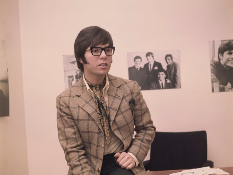 A young Cliff Richard is seen here in around 1970, wearing horn-rimmed spectacles, a windowpane check jacket and a paisley cravat