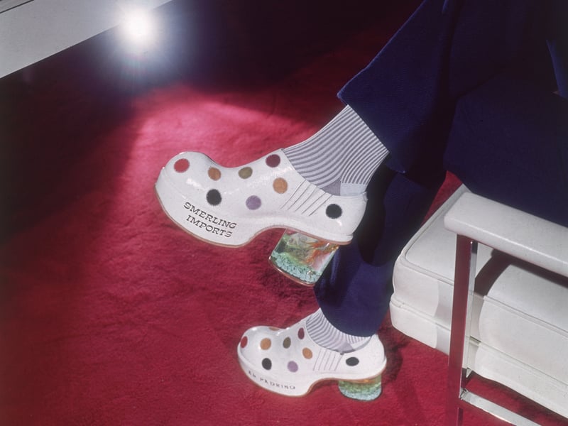 Leather polka dot platform shoes by Smerling Imports, with miniature goldfish bowls inside the heels, in January 1973