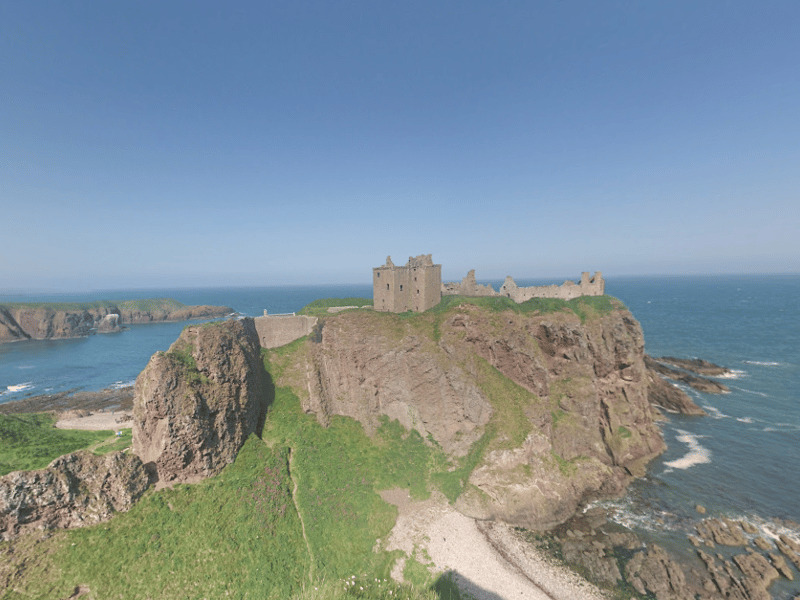 Dunnottar Castle is a ruined medieval fortress located upon a rocky headland about 2 miles south of Stonehaven in Aberdeenshire. The surviving buildings are largely of the 15th and 16th centuries, but the site is believed to have been fortified in the Early Middle Ages.