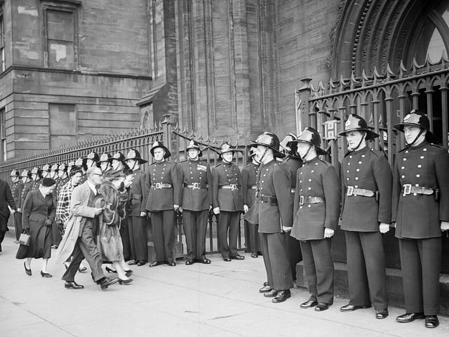 Relatives arrive at the funeral of 19 firemen who died in the Arbuckle Smith whisky bond fire at Cheapside Street in Glasgow in March 1960. The funeral was held at Glasgow's St Andrews Roman Catholic cathedral.