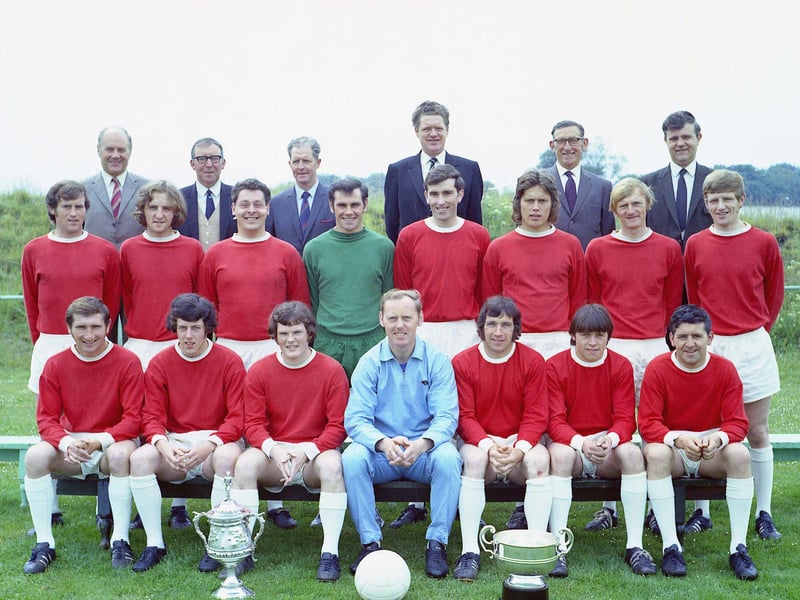 Arbroath Vics football team showing off the trophies they won in 1970 - the Forfar Businessmen's Trophy and the Arbroath and District Cup.