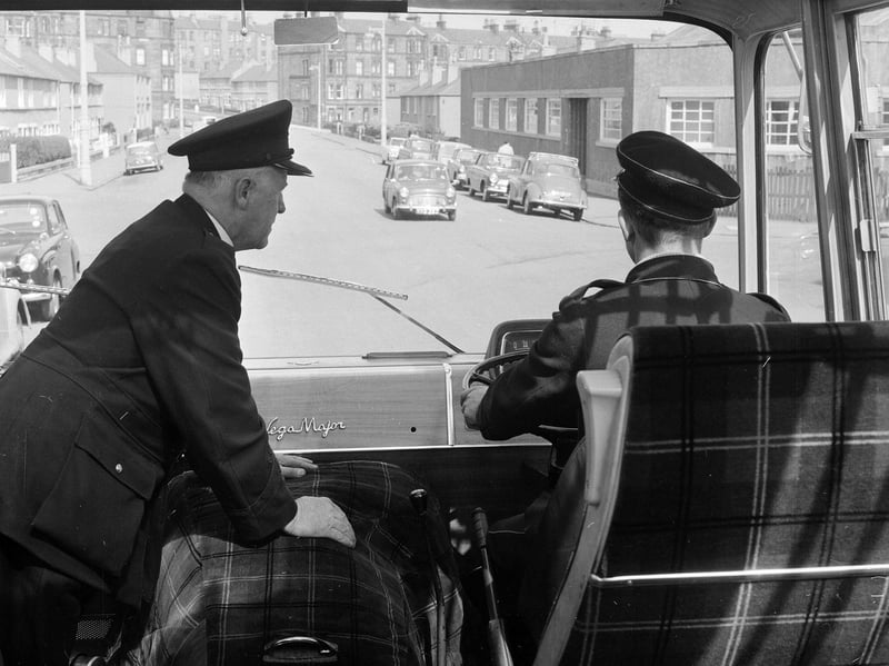 A trainee bus driver receives instruction from Inspector Jimmy MacDonald in 1965