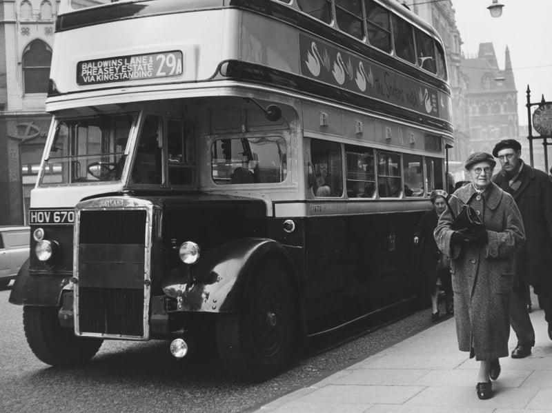 Passengers get off a Birmingham Corporation bus in February 1962