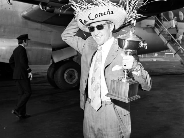 Scottish boxer Ken Buchanan arrives back in Edinburgh with his Gold Cup - and a few souvenirs - after beating Ismael Laguna in San Juan to take the World Lightweight title in September 1970.