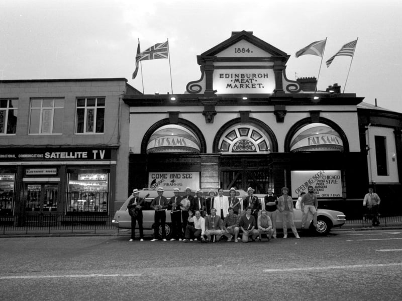 Staff dressed as gangsters beside a stretch limousine to advertise the opening of Fat Sam's Chicago-style diner and bar on the site of the Edinburgh meat market at Fountainbridge in September 1986