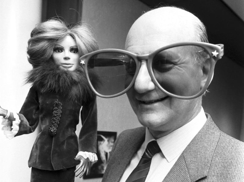 Thunderbirds creator Gerry Anderson with a Lady Penelope puppet and 'Brains'-style glasses at the City Arts Centre, Edinburgh, March 1986