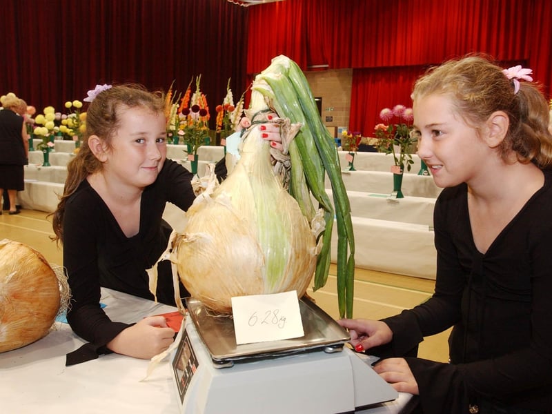 Makala and Chantelle Sleightholme were admiring the winning onion in the 2005 Sunderland Horticultural Show.