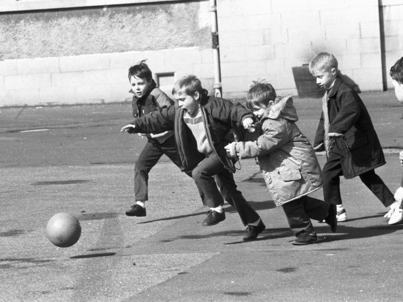 Little boys playing football in the playground of St John's RC Primary School, Edinburgh, in April 1989