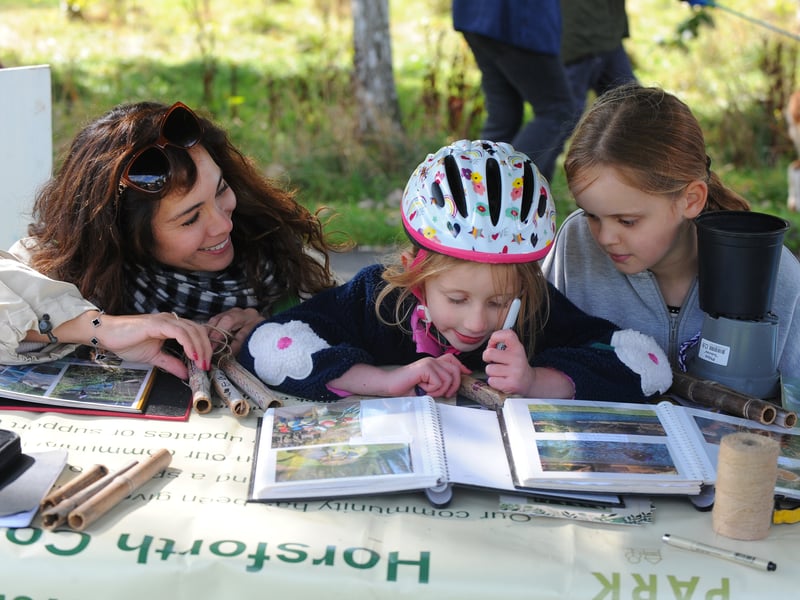 Tahlia Borlant of Friends of Horsforth Hall Park, helping Imogen Dale, five, of Cookridge and Bella Graham, 10, of Horsforth making DIY wind chimes