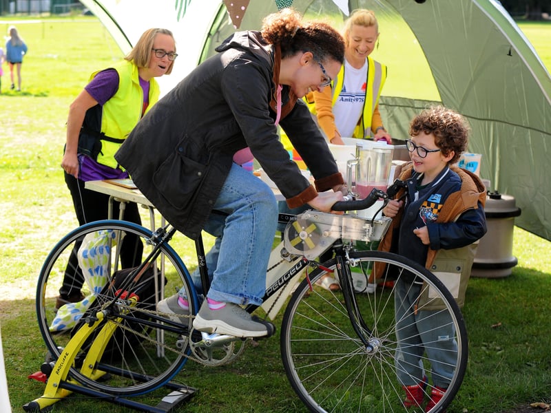Mum Emma Wallace of Horsforth peddling along to make a bicycle powered smoothie for son Luca, five, looking ready for his drink