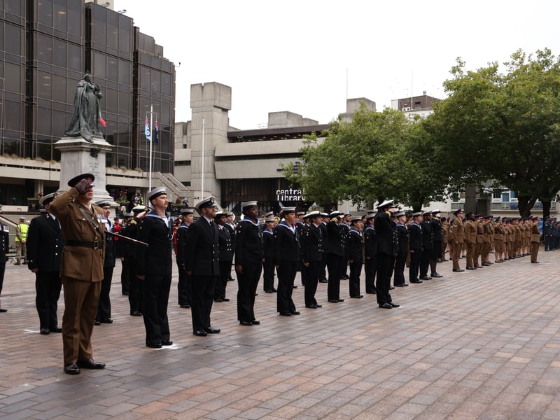 Joint Hospital Group South saluting during the national anthem on the steps of Guildhall.