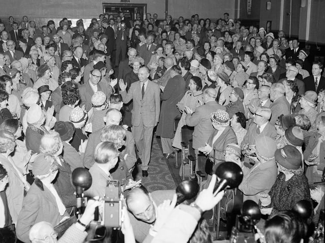 Former Prime Minister Sir Alex Douglas-Home and his wife are greeted by supporters in Crieff during his tour before the General Election of 1964.