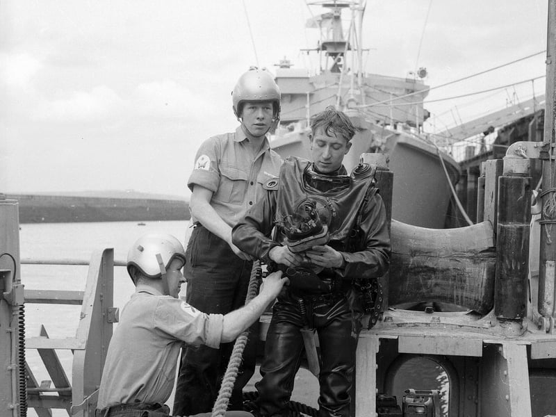 Royal Navy divers on the hunt for mines off the Scottish coast in 1964.