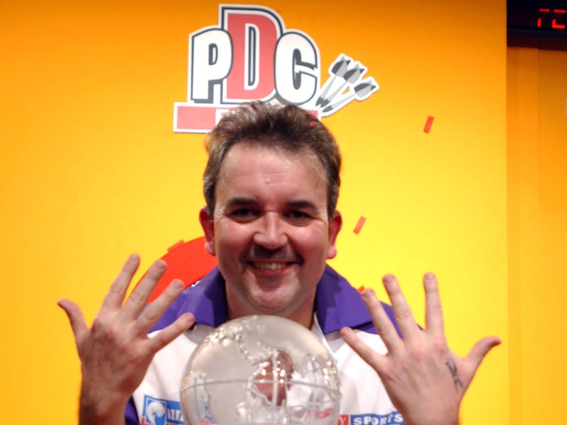 Before the teen darts sensation Luke Littler was even born, Phil 'The Power' Taylor ruled the oche. He is pictured here in January 2002 after winning the PDC World Darts Championships for the 10th time.
