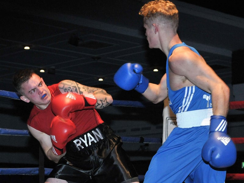 C. Lynn (RNBA) puts pressure on Ryan Morgan (Gosport ABC) during the first bout of the Titchfield Amateur Boxing Club evening held at the Guildhall in 2014.