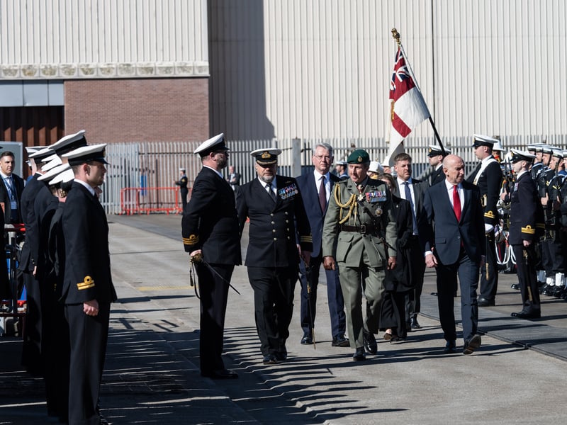 The Secretary of State for Defence, Rt Hon John Healey MP (right) and the 1st Sea Lord, General Sir Gwyn Jenkins (centre-right), seen here arriving at the commissioning ceremony of HMS Agamemnon.