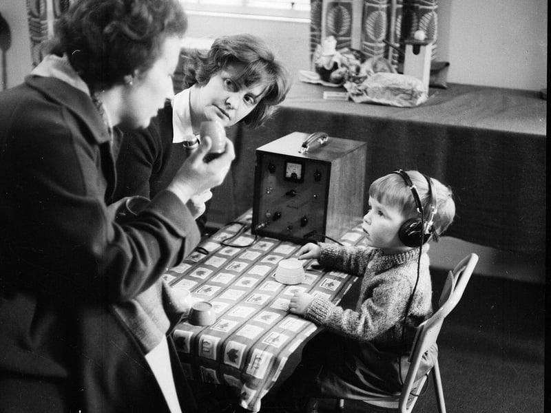 A pupil and teachers at Donaldson's school for the Deaf in Edinburgh