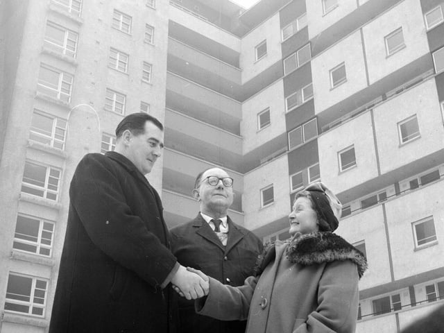 A councillor shakes the hand of Alice Mann, one of the first residents of the New Dumbiedykes Flats in Edinburgh in 1959.