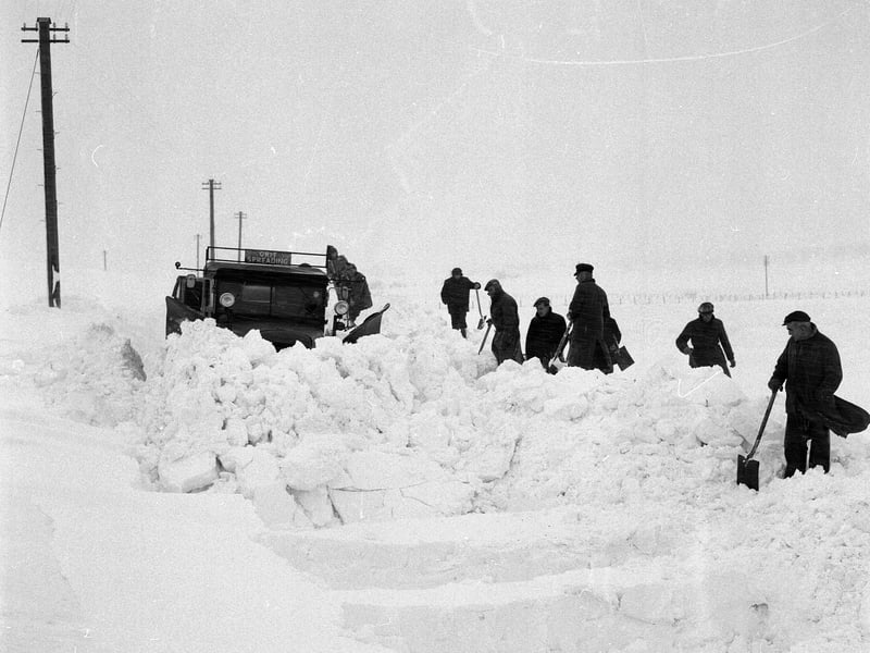 Clearing deep drifts of dnow on the road to Peebles in 1959.