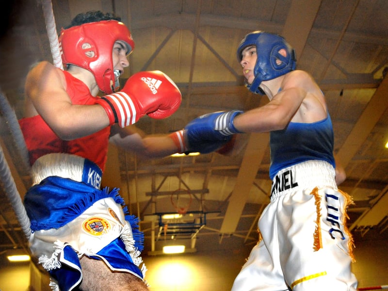 Kieran Rodden (red) battles Jack Daniel (blue) in the Class A National Finals at the Heart of Portsmouth Boxing Academy in 2010.