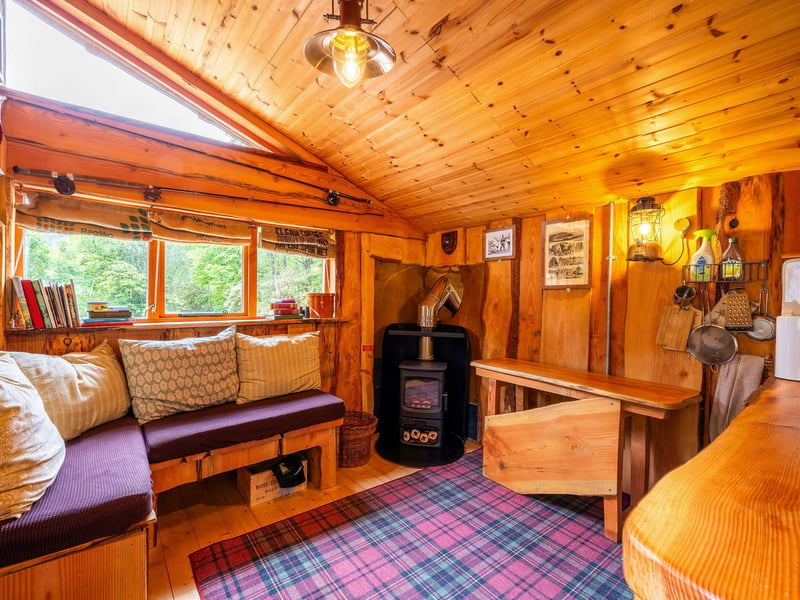 All three bothies share a Swedish-style outdoor bath and are insulated with sheep wool. This is the living space.