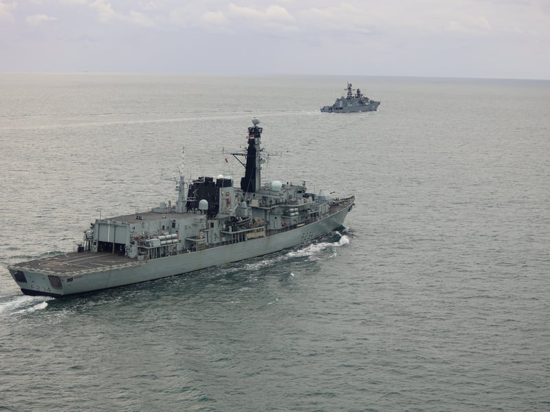 HMS Iron Duke shadows RFN Neustrashimy and cargo ship Sparta IV as they sail through the English Channel.