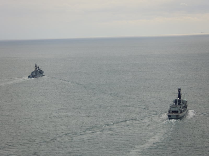 HMS Iron Duke shadows RFN Neustrashimy and cargo ship Sparta IV as they sail through the English Channel.