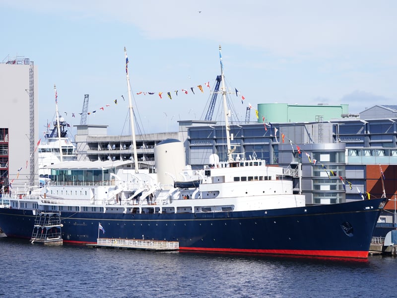 The Royal Yacht Britannia is moored just two miles from Edinburgh's city centre at Ocean Terminal. It is the former floating residence of Queen Elizabeth II and the Royal Family, sailing over 1,000,000 nautical miles across the globe between 1953 to 1997. Tourists can now admire the ship's five decks, engine room and Queen Elizabeth II's favourite room - the Sun Lounge