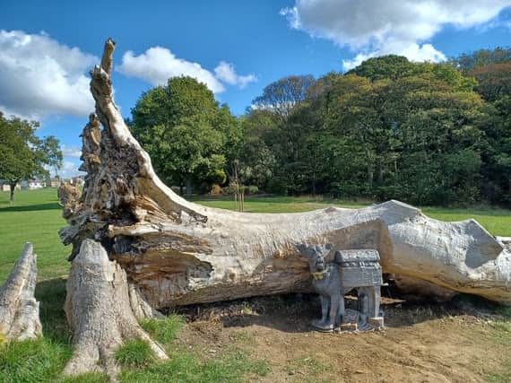 A cast iron dog was  placed by Graves Park's lone tree, which toppled in 2023 as Storm Elin brought strong winds to the county.