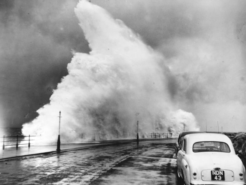 Waves foamed 40 to 50 ft into the air over Marine Drive in February 1958.