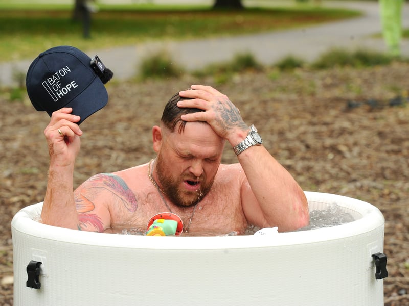 Harry Beattie otherwise known as Ice Bath Harry takes his daily ice bath in Victoria Park in support of the Baton of Hope procession.