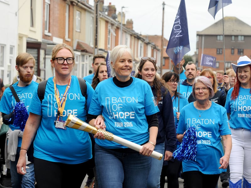 Becki Simmons, founder of Spark Community Space, carrying the baton.