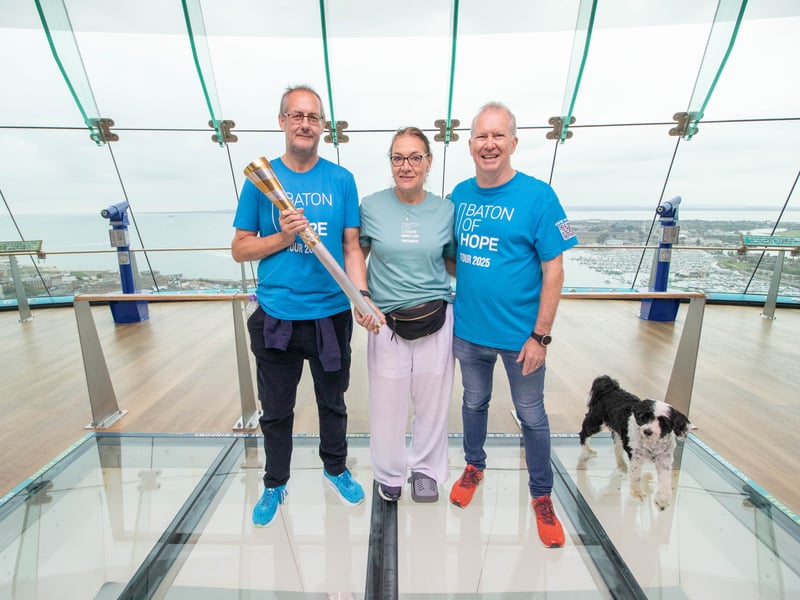 Baton of Hope arrives at the Spinnaker Tower. Pictured: Rod Sessions, Lara Kynvin and Andrew Major.