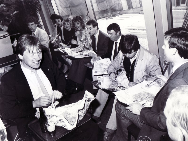German visitors from Sheffield's twin town, enjoy a traditional English meal of fish and chips in newspaper at the Vulcan Restaurant, Sheffield Town Hall, in May 1986