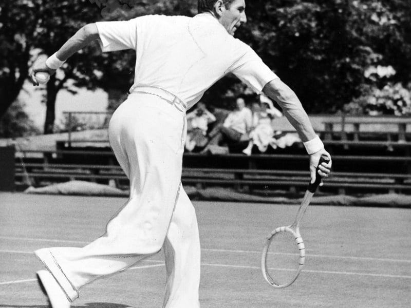 Tennis star Fred Perry in action in the town in August 1950.