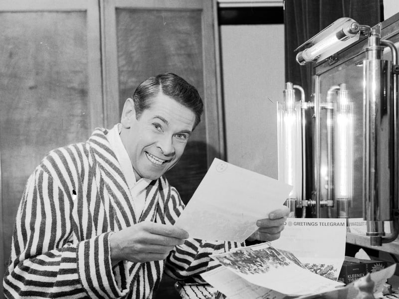 Scottish entertainer Stanley Baxter reads some of his telegrams in his dressing rooms backstage at the Kings Theatre in Edinburgh in April 1966.