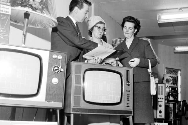 An Evening news & Dispatch 'Find the Ball' competition winner uses her 'Shopping Spree' prize to buy a television set at Telectra House in Great Junction Street, Leith, in June 1966.