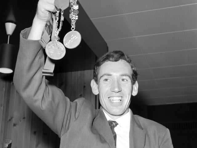 Scotland's Jim Alder displays the medals he won at the 1966 Commonwealth Games in Kingston, Jamaica - gold for the marathon and bronze for the six mile race.