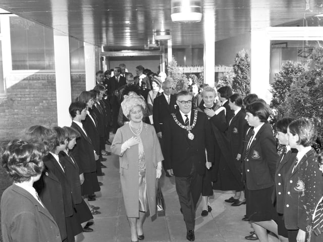 Lord Provost Herbert Brechin introduces the Queen Mother to some of the girls at James Gillespie's High School during her visit in October 1966.