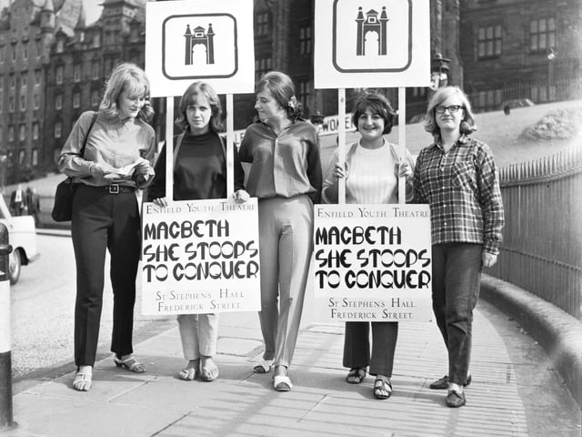 Girls from Enfield Youth Theatre wear sandwich boards to promote their productions of 'Macbeth' and 'She Stoops to Conquer' during the Edinburgh International Festival 1966.
