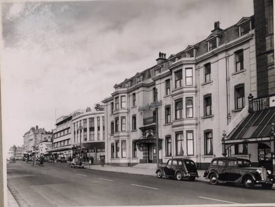 County Hotel on the corner of the promenade and Church Street. To the right is part of the glass canopy of The Palace