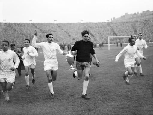 Real Madrid's Marquitos and Dominguez parade the European Cup around Hampden Park with their teammates after winning the trophy for the fifth successive year. The Spanish giants beat Eintracht Frankfurt.