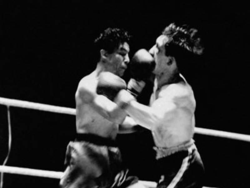 Scottish boxer Jackie Paterson, right, takes a right to the face from the Mexican Manuel Ortiz during a boxing match at Hampden Park in 1949.
