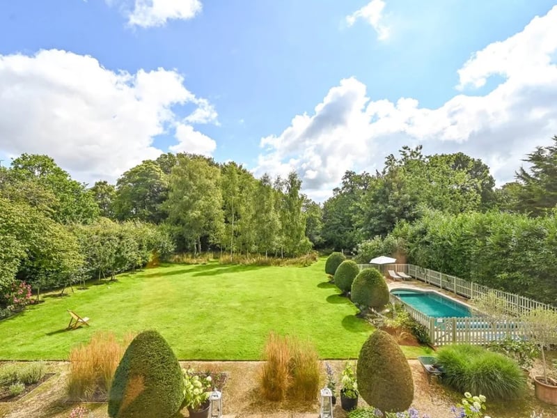 This home comes with six bedrooms, three bathrooms and four reception rooms as well as a swimming pool. 