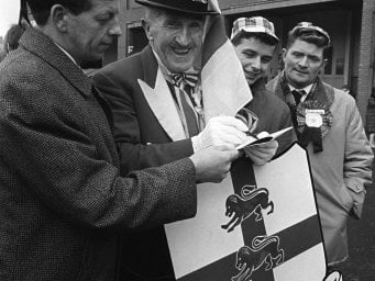 England team mascot, Ken Baily, of Bournemouth, with Scottish supporters at Hampden.