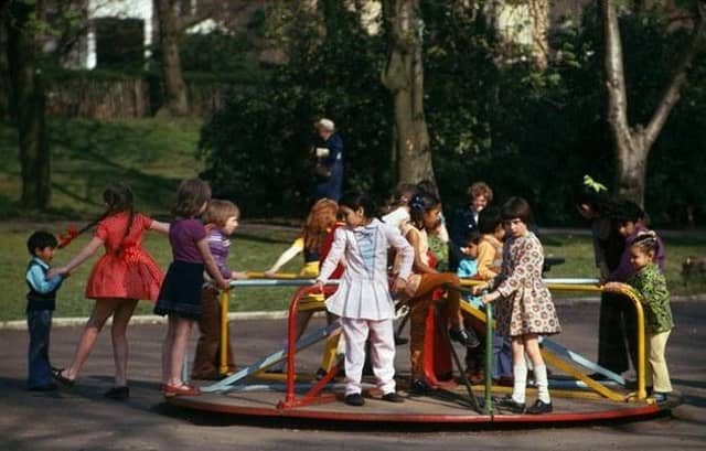 Children on the roundabout at Maxwell Park in 1974.