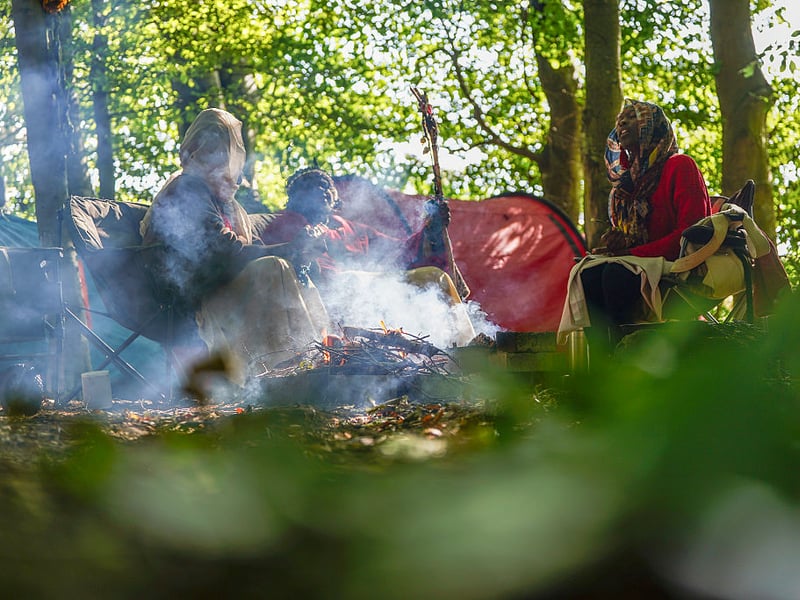 The camp consisted of a few tents, while meals were made over a campfire.