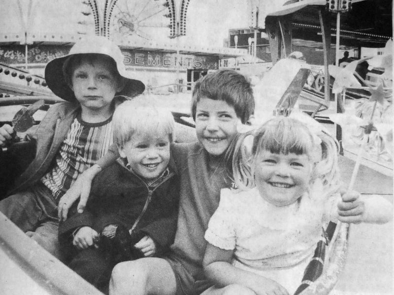 Flying their own planes at Southsea funfair was, left, Colin James, seven, and his sister Kelly, four, right, whose father was serving in HMS Glamorgan. Centre right is Anthony Jones, two, whose father was serving in HMS Fearless.
Centre left is Anthony's friend for the day, five-year-old Adrian Frearson.