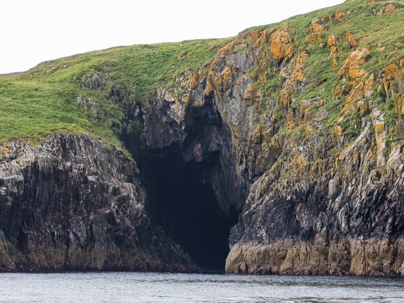 The island boasts stunning landscape, including dramatic cliff edges and coves
